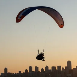 paragliding over New York at sunset
