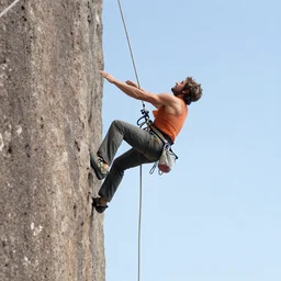 ashton kutcher repelling down a cliff in costa rica, photo