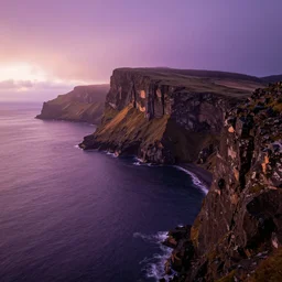 cliff landscape with violet water, 8 k, moody, intense color, fog, sunset light, highly detailed, dream landscape, wide, high color saturation,