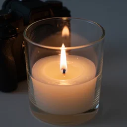 dslr photo of a candle made of glass, the flame is burning with a low glow, very high quality glass and flame, intricate details, extremely high quality, moody lighting, real camera, real photo, 8 k,