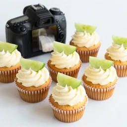 dslr food of delicious cupcakes with slices of picke on them, 8 5 mm f 1. 4