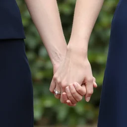 emma watson holding the hand of jfk