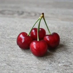 photo three cherries on a table
