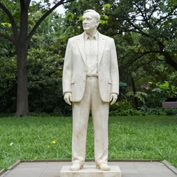 marble statue of coach Tomlin in a park