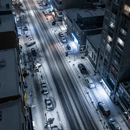 a city street at night, snowing, photograph, cyberpunk, sharp focus, intricate detail, drone shot, high resolution, 8k, neon streetlights, wires hanging down everywhere, Japan,