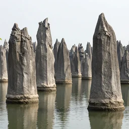 A swamp with many natural, tall stone spires rising from the water