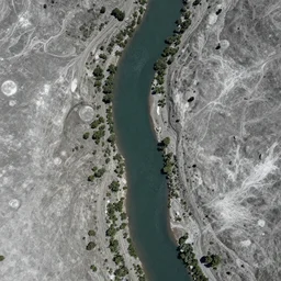 Photo of a river running across the surface of the moon, aerial shot