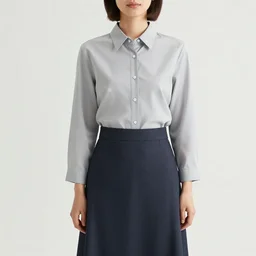 polish woman with short hair wearing an issey miyake shirt and skirt at a gas station, portrait, colored photo, clear face, by annie liebovitz, david bailey, nan goldin