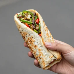 a crab holding a chipotle burrito