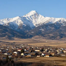 town on the plains, snow capped mountains in the background, d & d by greg rutkowski