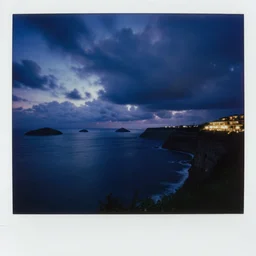 micro - hurricane, blue hour, early night, deep blue atmosphere, low light, black and blue sky, sundown, scattered islands, sea, ocean, low pressure system, cloud with eye, very windy, late evening, distant hotel retreat on cliffside, shining lights on cliff side, polaroid photograph