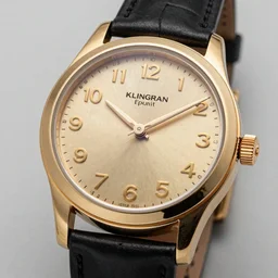 a watch made of gold and klingon numbers
