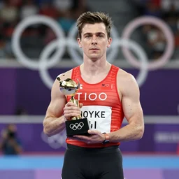 press photo of Thom Yorke winning Olympic sprint.