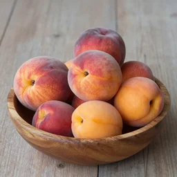 peaches, apricots, plums lie in a wooden bowl on a table, in the style of impressionism