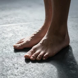a foot with a fanged mouth on the surface