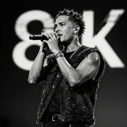 nekfeu on stage performing his new album, 8 k, very high resolution, photo, black and white, processing, extremely hyperdetailed