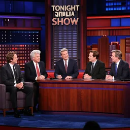 a tv still of david letter, jay leno, conan obrian, johnny carson, jimmy kimmel, stephen colbert, jimmy fallon, seth meyers hosting the tonight show