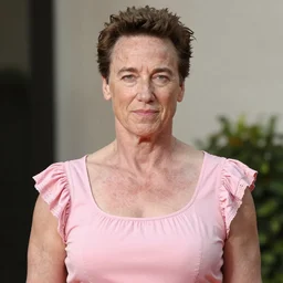 Arnold Schwarzenegger in a pink frilly dress