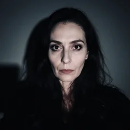 studio portait of evil old woman with dark eyes, mysterious, black hair, shadows, selfie