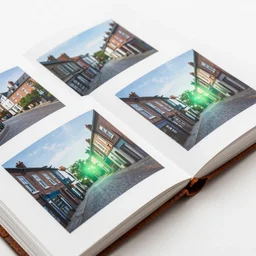rusty photos with white border in photo album on table, all photos showing innsmouth town streets, green light dust, magnificent, close up, sharp focus, evil fluid, negative energy, horror, creepy, serious, giger style, highly detailed, illustration, by jordan grimmer greg rutkowski wlop maya takamura, intricate, trending artstation, pixiv, digital art