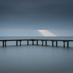 minimalist seascape photo of the sea and pier, long exposure, calm, flat smooth water