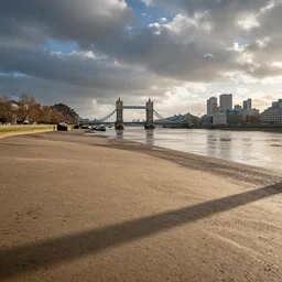 looking at the river thames in london, the dried up riverbed is empty due to drought