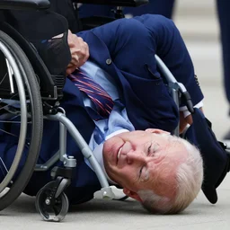 joe biden falling down a wheelchair, detailed, 8 k, detailed face, photorealistic, sharp focus
