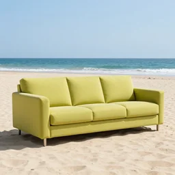 photo of a chartreuse sofa on a sandy beach