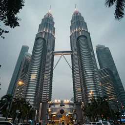 a cinematic extreme close - up of a street with kuala lumpur skyscrapers in the background, misty tropical evening, low angle view, fantasy art, highly detailed matte painting, telephoto lens 2 0 0 mm, by stanley artgerm lau, greg rutkowski, thomas kinkade, alphonse mucha, loish, norman rockwell, artstation